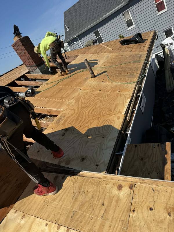 New roof decking install — safety harnesses in use