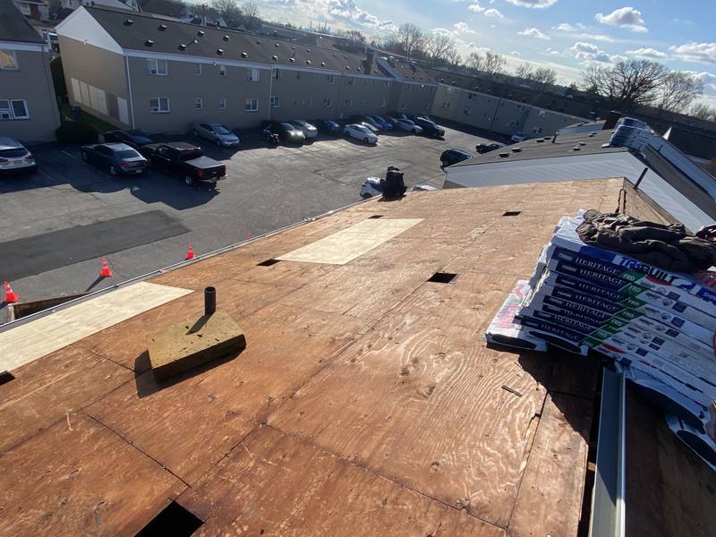 Commercial flat roof tear-off with fresh decking